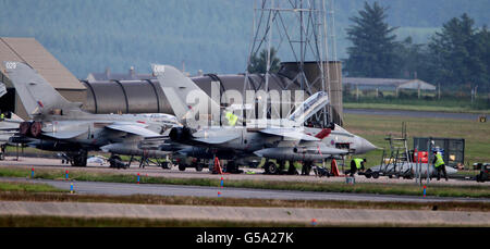 Air ground crew work on Tornado planes at RAF Lossiemouth, following an incident in which two RAF Tornados crashed off the coast of Scotland. Stock Photo