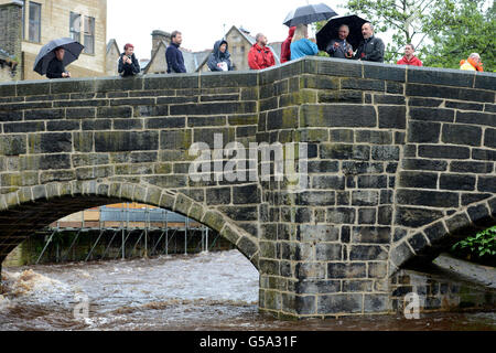 The Prince of Wales speaks with locals in Hebden Bridge, West Yorkshire, which was badly hit by the floods which devastated parts of West Yorkshire two weeks ago. Stock Photo