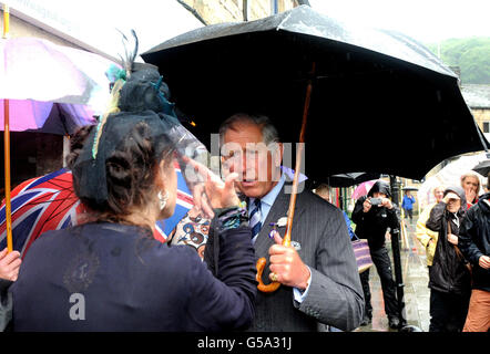 The Prince of Wales speaks with locals in Hebden Bridge, West Yorkshire, which was badly hit by the floods which devastated parts of West Yorkshire two weeks ago. Stock Photo
