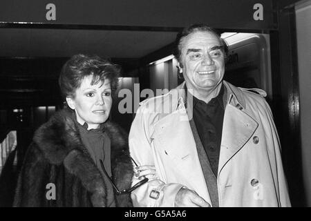 Film actor Ernest Borgnine and his wife, Tove, arriving at Heathrow Airport, before flying on to Sun City, South Africa for a Pro-Am golf tournament. Stock Photo