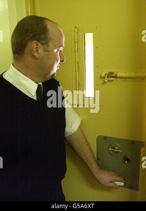 A warder closes a cell door in Brinsford Young Offenders Prison, outside Wolverhampton, which is the subject of a Chief Inspector of Prisons report in which Sir David Ramsbotham branded the institution a 'disgrace'. * ...after an inspection showed a 'breathtaking level of neglect and lack of understanding' towards inmates. Sir David said the inspection of HMYOI Brinsford was one of the most disturbing his team have had to conduct, describing conditions as a 'stain' on the Prison Service. Stock Photo