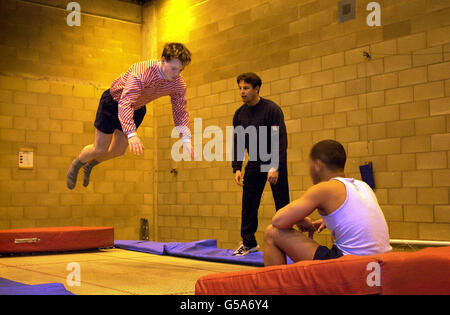 Prisoner Andrew Fraser practises his trampoline skills under the watchful eye of physical education officer Richard Jones (centre) at Brinsford Young Offenders Prison, near Wolverhampton, which is the subject of a Chief Inspector of Prisons report. * ...in which Sir David Ramsbotham branded the institution a 'disgrace', after an inspection showed a 'breathtaking level of neglect and lack of understanding' towards inmates. Sir David said the inspection of HMYOI Brinsford was one of the most disturbing his team have had to conduct, describing conditions as a 'stain' on the Prison Service. Stock Photo