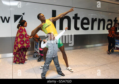 Passengers arriving at Terminal 5 of Heathrow Airport are greeted by a wax figure created by Madame Tussauds London of Jamaican sprinter Usain Bolt, which was officially unveiled at the airport before it goes on display at the the attraction in central London on Monday July 23. Stock Photo