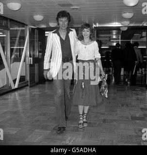 Actress Angharad Rees, accompanied by actor Robin Ellis, who were leaving for New York to promote the Poldark television series in the United States. Stock Photo