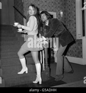 Actress Angharad Rees in a scene with Ralph Arliss at the Wyndham Theatre, London, where Kevin Laffan's new comedy about the Pill - 'It's a Two-foot-six-inches-above-the-ground World' opens following its success at the Bristol Old Vic. Stock Photo