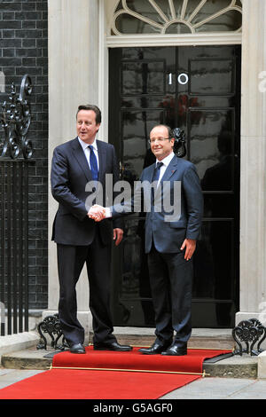 Prime Minister David Cameron welcomes the newly elected President of France, Mr Francois Hollande to number 10, Downing Street in Westminster central London, during the President's first official visit to the UK. Stock Photo