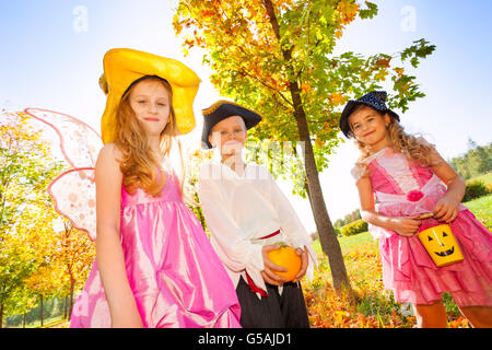 Friends in costumes at Halloween during day Stock Photo