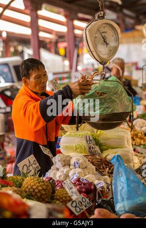A market seller vendor Produce and products on being sold in the Old Victoria Market in the City of Melbourne, Australia Stock Photo