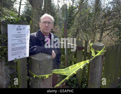 The Archbishop of York, the Right Reverend Dr David Hope stands beside a footpath that runs alongside his official residence Bishopthorpe palace near York. The footpath has been closed due to the foot-and-mouth crisis. *The Archbishop called for the General Election to be delayed because of the crisis. Stock Photo