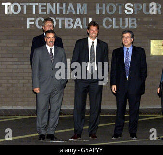 Newly appointed Tottenham Hotspur manager Glenn Hoddle (second from right) poses for photographers with his agent Dennis Roach (back, left), assistant John Gorman and Spurs executive vice-chairman David Buchler (right). Hoddle was unveiled as Tottenham s new manager at a White Hart Lane press conference. Stock Photo