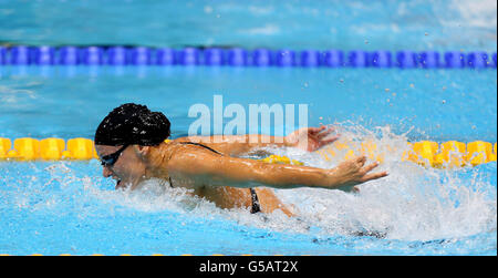 USA's Dana Vollmer on her way to winning gold and setting a new world record in the Women's 100m Butterfly Final at the Aquatics Centre, London, on the second day of the London 2012 Olympics. Stock Photo