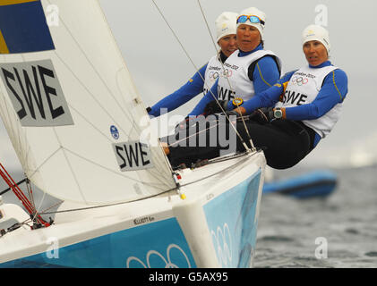 London Olympic Games - Day 5. Sweden's Women's Match Racing team of Anna Kjellberg, Malin Kallstrom and Lotta Harrysson on Weymouth Bay today during the Olympic Games. Stock Photo