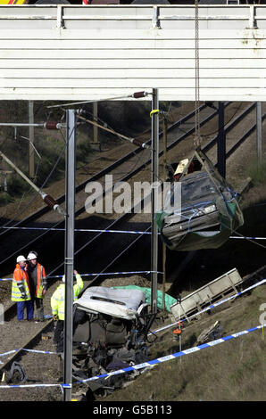A car is lifted from the train tracks near Great Heck, Yorkshire, following the train crash on 28/03/01. The remains of the Land Rover which the GNER train collided with can be seen towards the front of the photo (white roof). Stock Photo