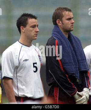 England's Captain John Terry (left) and Nicky Weaver line up for the National Anthems during the Under 21 World Cup Qualifier, at Qemal Stafa Stadium, Tirana, Albania. * 3/11/01: Chelsea central defender John Terry is back in the England Under-21 squad for the two-legged European Championship qualifier with Holland. Stock Photo
