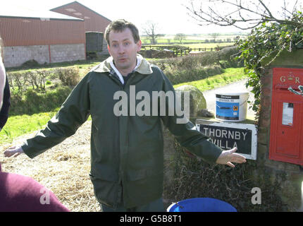 A vet from the Ministry of Agriculture, Fisheries and Food gestures outside a farm at Thornby, nr Wigton in Cumbria, which has been named as the 1,000th case of foot and mouth in Great Britain. There has also been one further case in Northern Ireland. * Evidence that the crisis may have turned a corner was delivered to Prime Minister Tony Blair at Downing Street earlier by the chief scientific adviser Professor David King. Earlier projections that the outbreak would spiral to more than 4,400 cases by June 2001 have now been revised down. Stock Photo