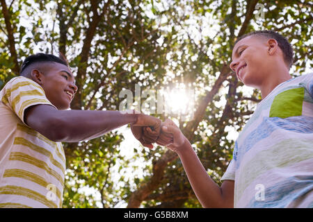 Youth culture, young multi ethnic people together. Black and white boys meeting. Concept of racism. Stock Photo