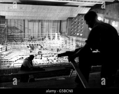 ROYAL FESTIVAL HALL 1951: Much of the interior scaffolding has disappeared but workmen are still busy inside the Royal Festival Hall, now nearing completion on the South Bank site, London, in readiness for the 1951 Festival of Britain. Stock Photo