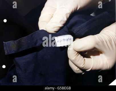 Kent Police issued picture of a telephone number written on a label inside a pair of trousers belonging to one of the illegal immigrants that died in the back of Dutch lorry driver Perry Wacker's container lorry in June 2000. Mr Wacker has been found guilty at Maidstone Crown Court of the mansalughter of 58 Chinese immigrants and his accomplice Ying Guo, of South Woodford, Essex, was also found guilty of conspiring to smuggle illegal immigrants into the UK. Stock Photo