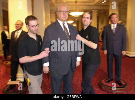 Staff at Madame Tussauds, London, remove a waxwork of former German chancellor, Helmut Kohl, to make way for his successor, Gerhard Schroeder (R). Stock Photo