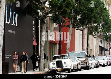 A white Rolls Royce parked on Rodeo Drive in Beverly Hills, Los Angeles. Stock Photo
