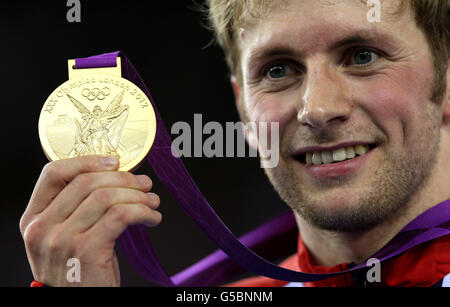 Great Britain's Jason Kenny celebrates with his gold medal after winning the Men's Sprint Final at the Velodrome in the Olympic Park, on the tenth day of the London 2012 Olympics. Stock Photo