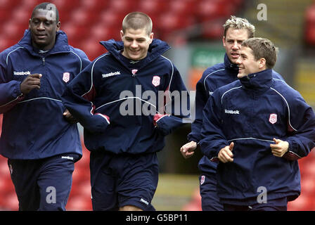Liverpool Midfielder Steven Gerrard (second left) shares a joke with Michael Owen (right) as they jog with Emile Heskey (left) and Stephane Henchoz during an open training session at Anfield, Liverpoo, ahead of their two Cup Finals this month. Liverpool play Arsenal in the FA Cup Final on the 12th May 2001, and then take on CD Alaves in the UEFA Cup Final on the 16th May 2001. Stock Photo