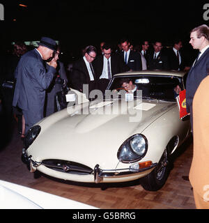 Long, low and sleek are the lines of the E-Type Jaguar sports car, pictured at the Earl's Court International Motor Show. Stock Photo