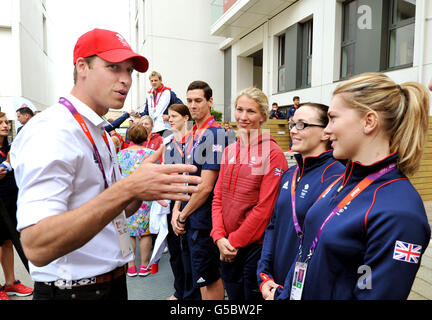 The Duke of Cambridge talks with Great Britain cyclist Victoria Pendleton (second right) during a visit to the Team GB accommodation flats in the Athletes Village at the Olympic Park in Stratford, east London. Stock Photo