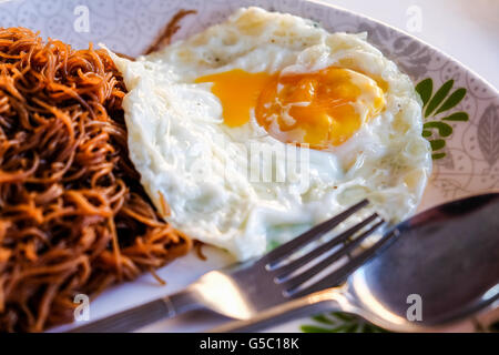 fried noodles with egg is a breakfast food choice people in Asia Stock Photo