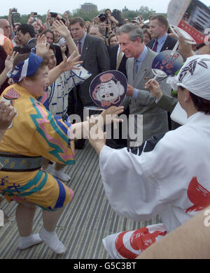 Prince Charles dances with traditional Japanese dancers as he visits the Festival of Japan in London. Prince Charles visited the festival with Japan Crown Prince Naruhito who is visiting Britain. Stock Photo