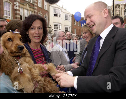 Conservative Party leader Willaim Hague meets Tiffin the dog and her owner, in Winchester, Hampshire, during a frenetic last day of campaigning with his wife Ffion (centre right) before the General Election. *Mr Hague addressed a crowd of about 400 cheering supporters from the steps of the Butter Cross, a memorial - which the Tories hope will prove symbolic - to William the Conqueror. Stock Photo