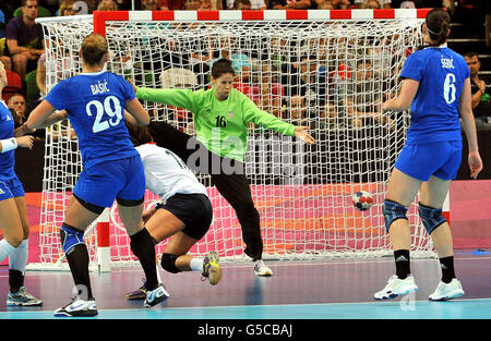 Britain's Ewa Palies (in white) scores against Croatia, during their handball match at the Copper Box Arena, London during day nine of the London 2012 Olympics. Stock Photo