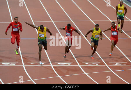 Jamaica's Usain Bolt wins the men's 100m final on day nine of the Olympic Games at the Olympic Stadium, London. Stock Photo