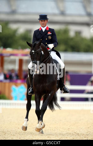 Great Britain's Carl Hester riding Uthopia after completing his test in the Individual Grand Prix Special Team final at Greenwich Park, London. Stock Photo