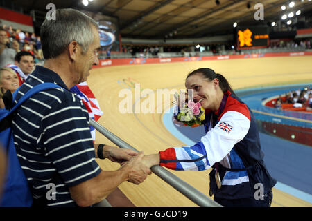 Great Britain's Victoria Pendleton (right) is in tears as she is consoled by her father Max Stock Photo