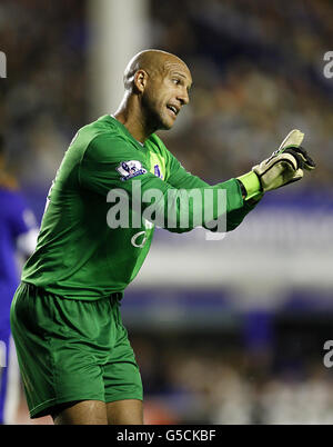 Everton goalkeeper Tim Howard of the United States, right, smiles