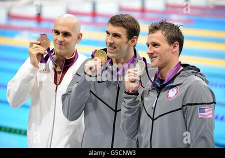 (Left to right) Bronze Medalist Hungary's Laszlo Cseh, Gold Medalist USA's Michael Phelps and Silver Medalist USA's Ryan Lochte celebrate with their medals after the Men's 200m Individual Medley at the Aquatics Centre in the Olympic Park, London, on the sixth day of the London 2012 Olympics. Stock Photo