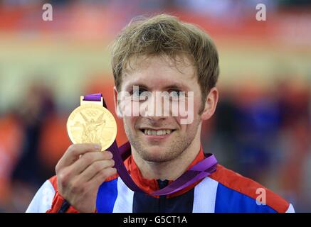 Great Britain's Jason Kenny celebrates with his gold medal after winning the Men's Sprint Final at the Velodrome in the Olympic Park, on the tenth day of the London 2012 Olympics. Stock Photo