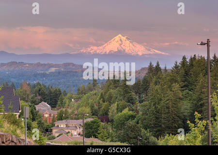 Mount Hood evening alpenglow during sunset from Happy Valley Oregon residential neighborhood in Clackamas County Stock Photo