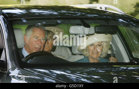 The Prince of Wales and Duchess of Cornwall (right), known as the Duke and Duchess of Rothesay when in Scotland, arrive ahead of the Sunday service at Crathie Kirk near Balmoral Castle, during the annual Royal summer break at Balmoral. Stock Photo