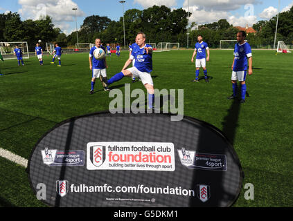 Soccer - Fulham Foundation Event. Players warm up before the Fulham Foundation event which helps people get back into the community through sport Stock Photo