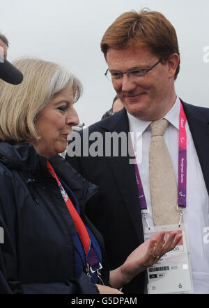 Home Secretary Theresa May talks with Chief Secretary to the Treasury Danny Alexander (right) during the rowing finals at Eton Dorney in Berkshire during the Paralympic Games. Stock Photo