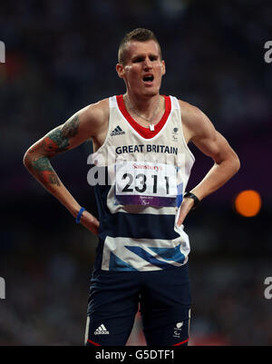 Great Britain's David Devine waits to find out his result, in which he won Bronze during the Men's 800m - T12 Final at the Olympic Stadium, London. Stock Photo
