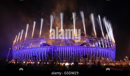 Fireworks explode over the Olympic stadium during the closing ceremony for the 2012 Paralympics games. Stock Photo