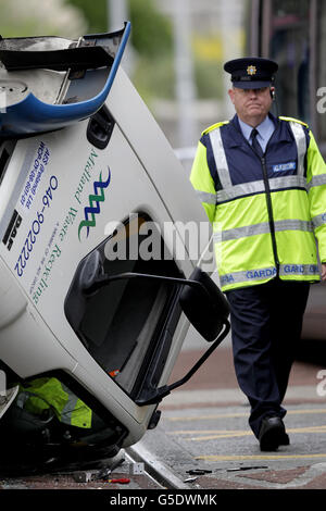 Garda at the scene in Benburb Street, Dublin, after a Luas red line tram and a skip truck collided. Stock Photo