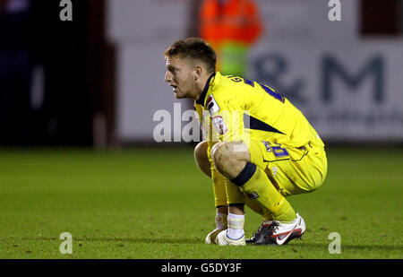 Carlisle United goalkeeper Mark Gillespie sits dejected after the penalty shoot-out Stock Photo