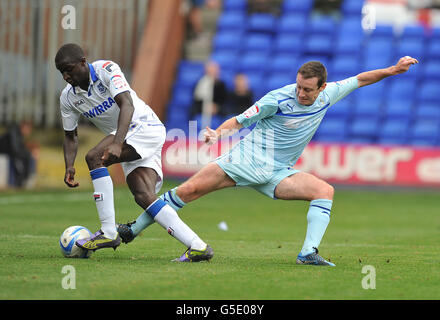 Tranmere Rovers Zoumana Bakayogo and Coventry City's Stephen Elliott battle for the ball during the npower Football League One match at Prenton Park, Tranmere.