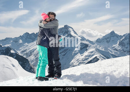 Couple hugging on the mountain. Les 2 Alpes, French Alps Stock Photo