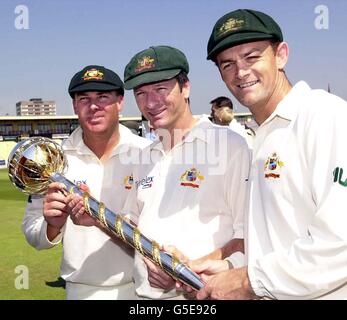 Australia's Cricket captain Steve Waugh (centre) with Shane Warne (left) and Adam Gilchrist holding the ICC Test Championship Trophy at Edgbaston, Birmingham. The newly inaugurated award is presented to the best team in Test match cricket. * England and Australia begin the Ashes Series with the first in power Test match on Thursday. Stock Photo