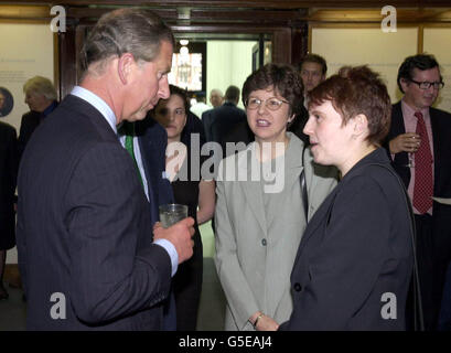 The Prince of Wales talks to librarians Nicola Barnett (R), from Burslem, Stoke-on-Trent and Jean Capaldi from Churchdown, Gloucester at the Round Reading Room in the British Library. *...where the Prince attended a celebration to mark the end of The Everyman Millennium Library Project which provided free books to schools. The Project was funded by a 4 million grant from the Millennium Commission and an equal amount raised by other groups. Stock Photo